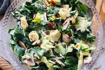 Spinach Tortellini salad bowl with all of the ingredients in it