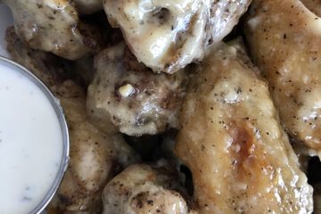 Parmesan Garlic Chicken Wings in a plate with ranch dressing