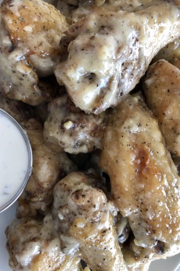 Parmesan Garlic Chicken Wings in a plate with ranch dressing