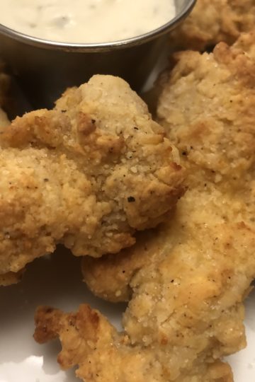 Air Fryer Chicken Strips up close photo with dipping sauce.