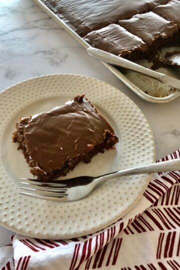The BEST easy Texas Sheet Cake on a plate for eating