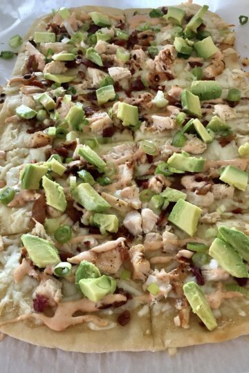 Chicken Bacon Avocado Flatbread cut into pieces for serving