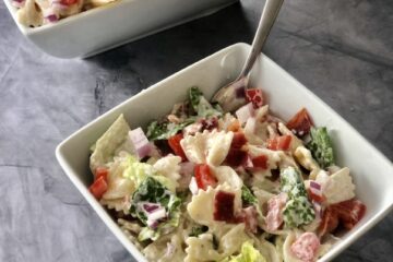 a bowl of BLT Ranch Pasta Salad next to a large bowl of BLT Ranch Pasta Salad